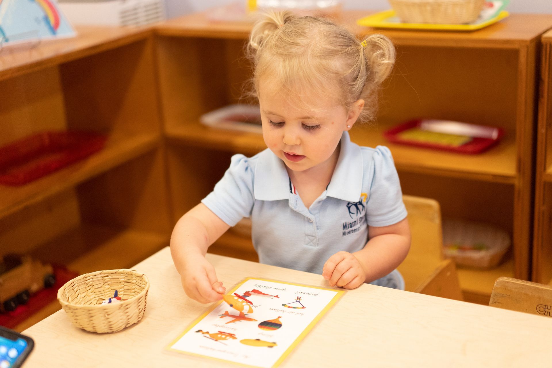 montessori toddler working inside the classroom