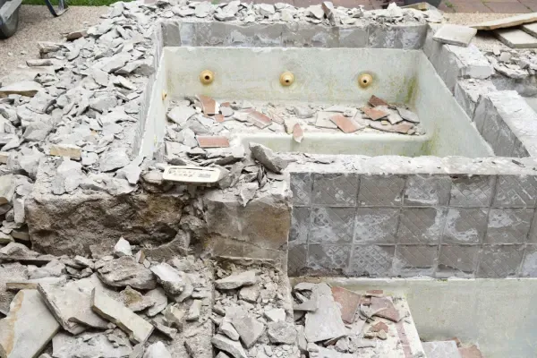 Professional pool demolition and site cleanup.