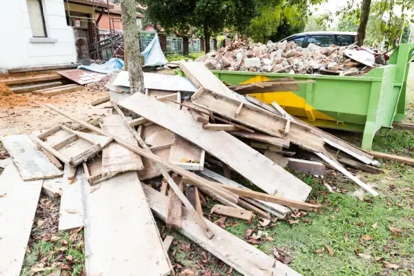 Removing construction waste and rubble from a worksite.