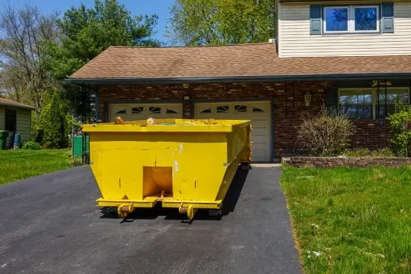 Removing clutter and items from a residential garage.