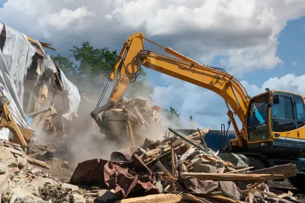 Demolishing a residential structure for redevelopment.
