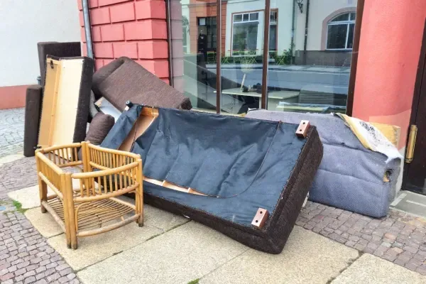 Removing old furniture from a home.