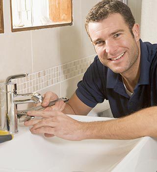local plumber fixing sink