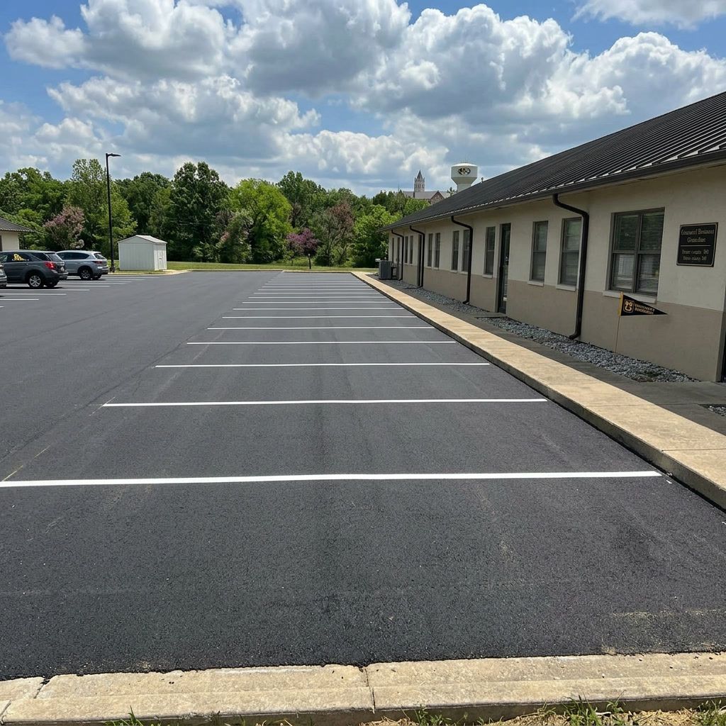 Fresh parking lot restriping in Columbia, MO with bright lines, organized stalls, and clean pavement markings