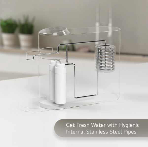 Clear water filter with stainless steel pipes; filters, coiled pipe, and a spout; countertop setting.