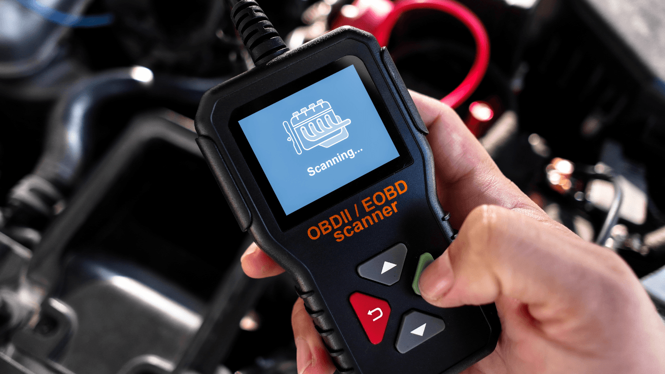 an auto repair expert scanning a vehicles software system