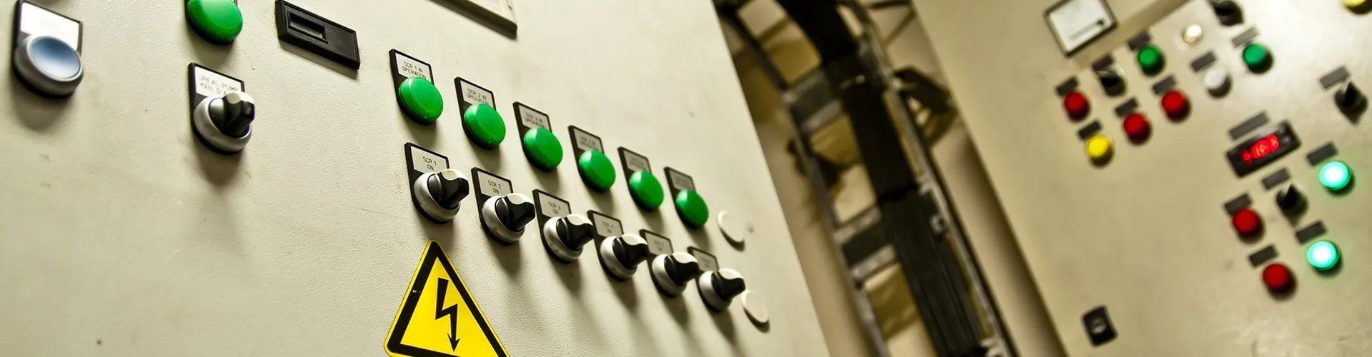 A Wall With a Lot of Buttons and Lights on It — ElectroMech Machine in Woolner, NT