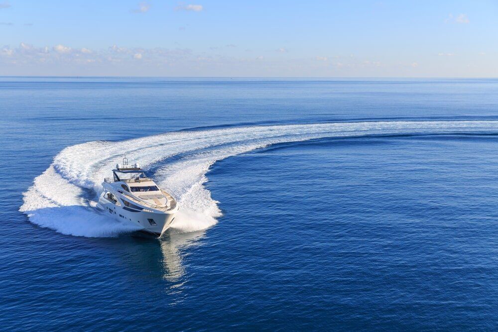 A Boat is Floating on Top of a Large Body of Water — ElectroMech Machine in Woolner, NT