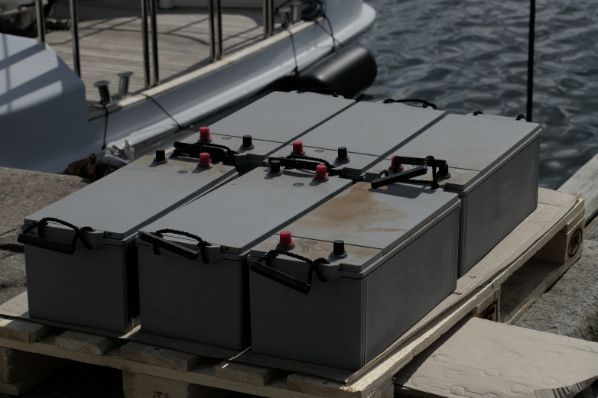 Six Batteries Are Stacked on a Wooden Pallet — ElectroMech Machine in Woolner, NT