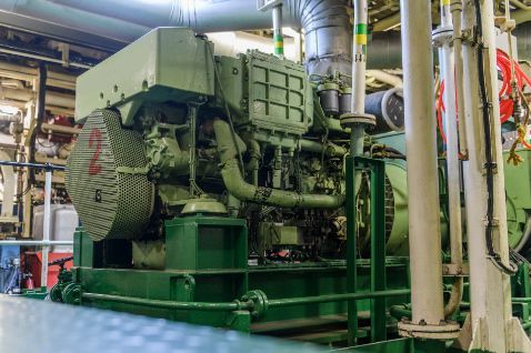 A Large Green Engine is Sitting in the Middle of a Factory — ElectroMech Machine in Woolner, NT
