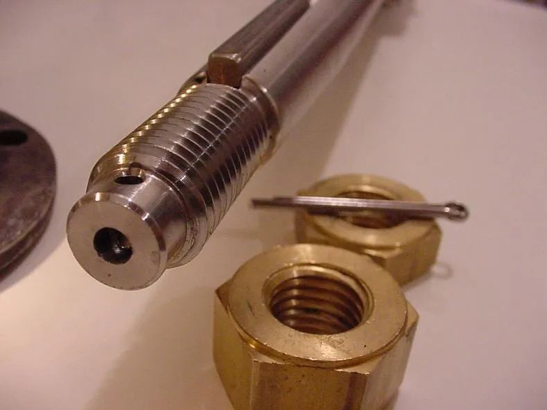 A Close Up of a Metal Object With Nuts and a Pin — ElectroMech Machine in Woolner, NT
