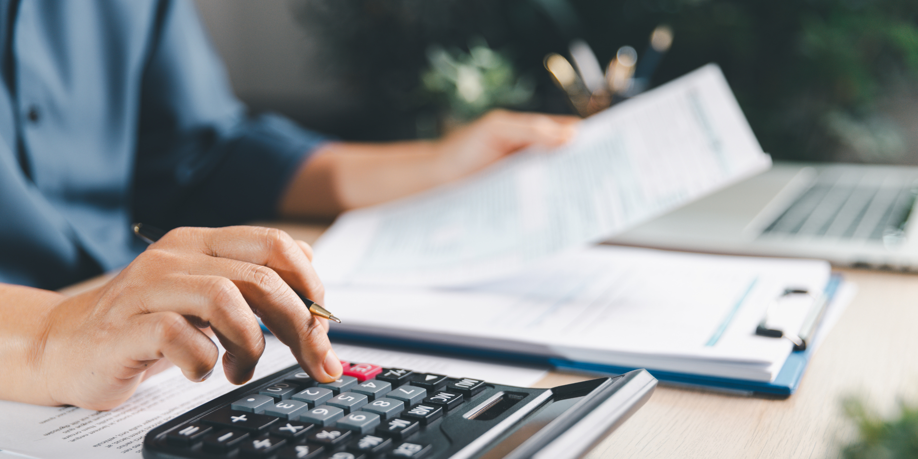 Financial advisor discussing wealth planning with clients in a professional office