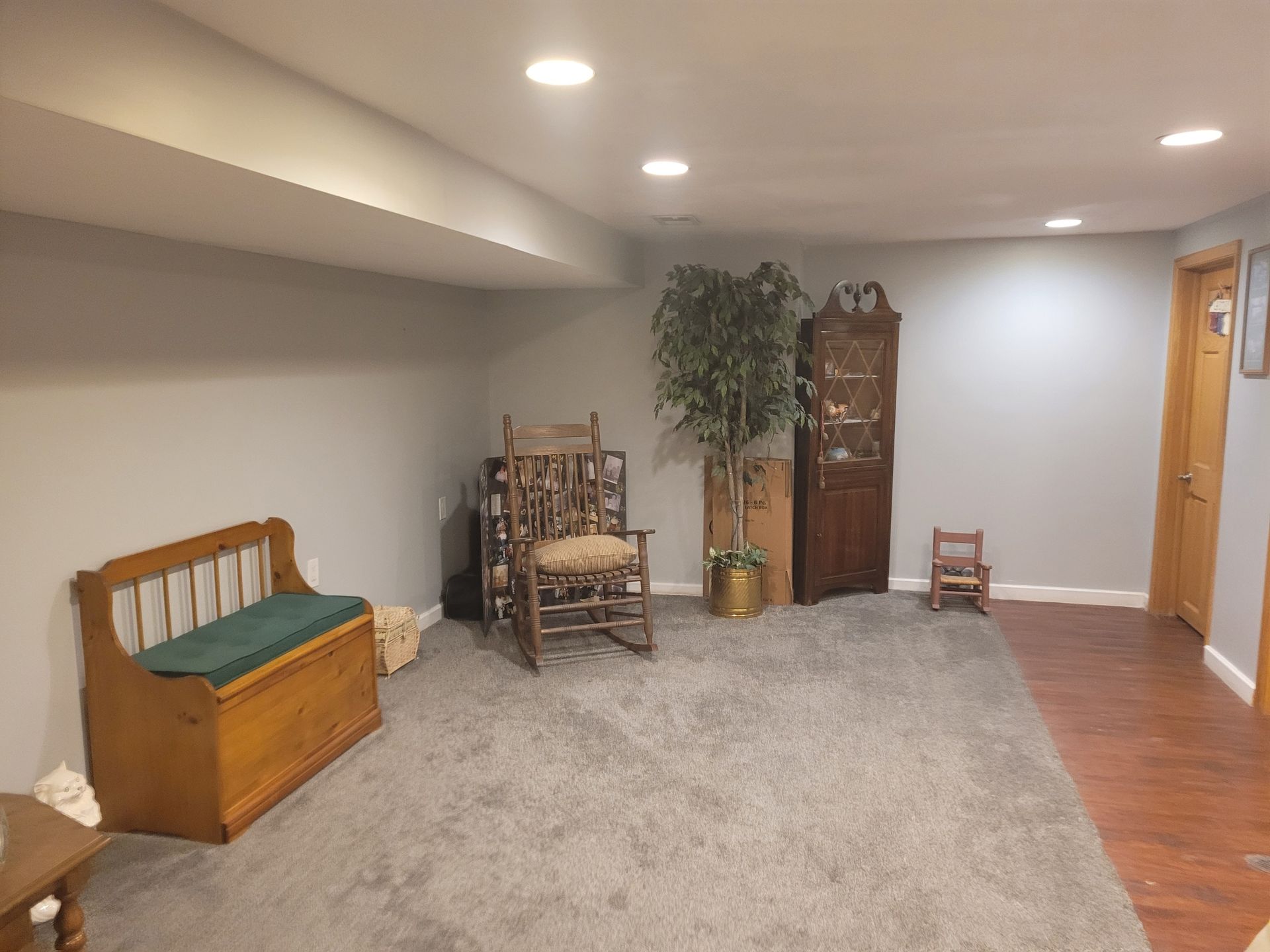 There is a rocking chair in the middle of the room.