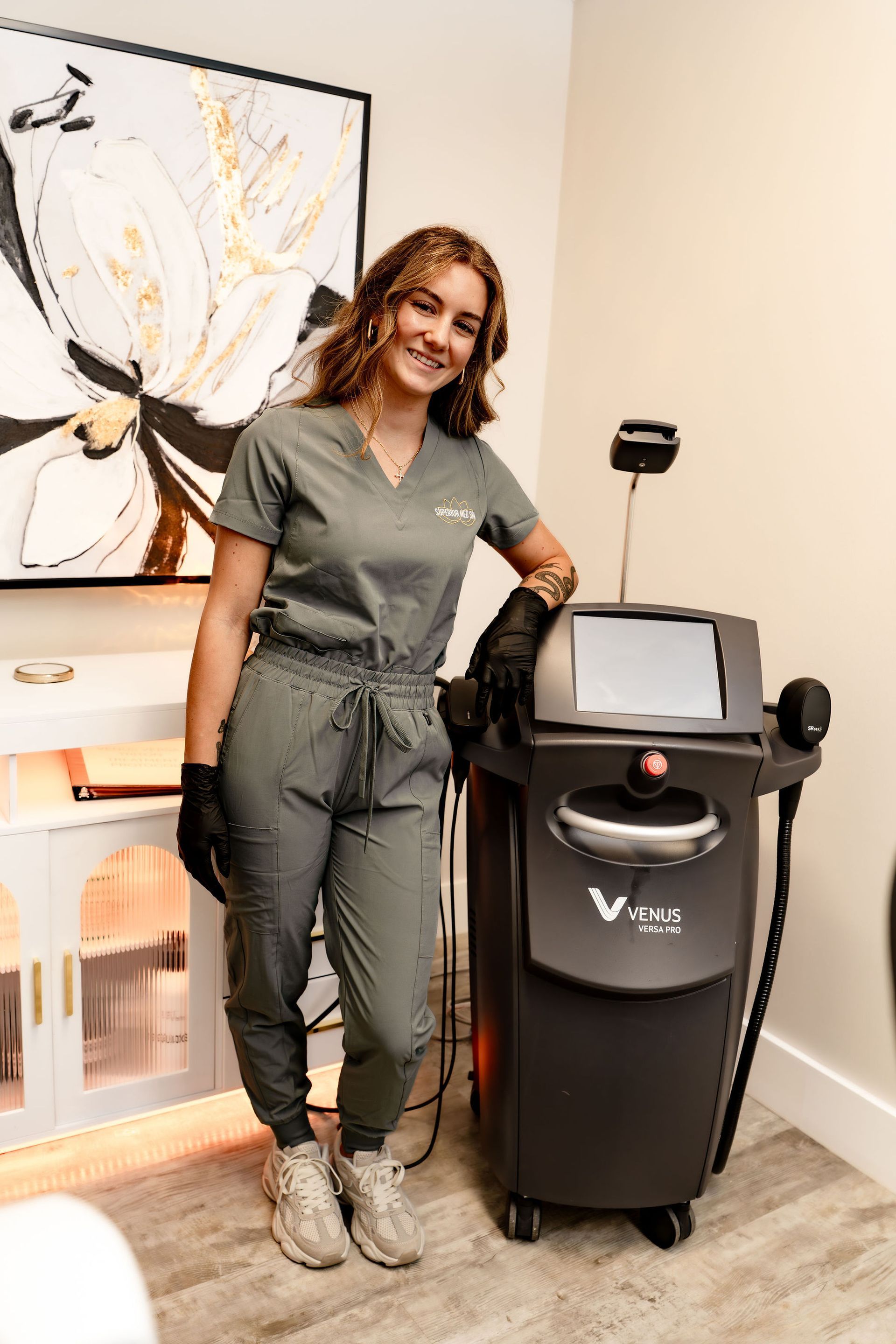 Venus Versa Pro machine with a touch screen displaying the brand logo, in black.