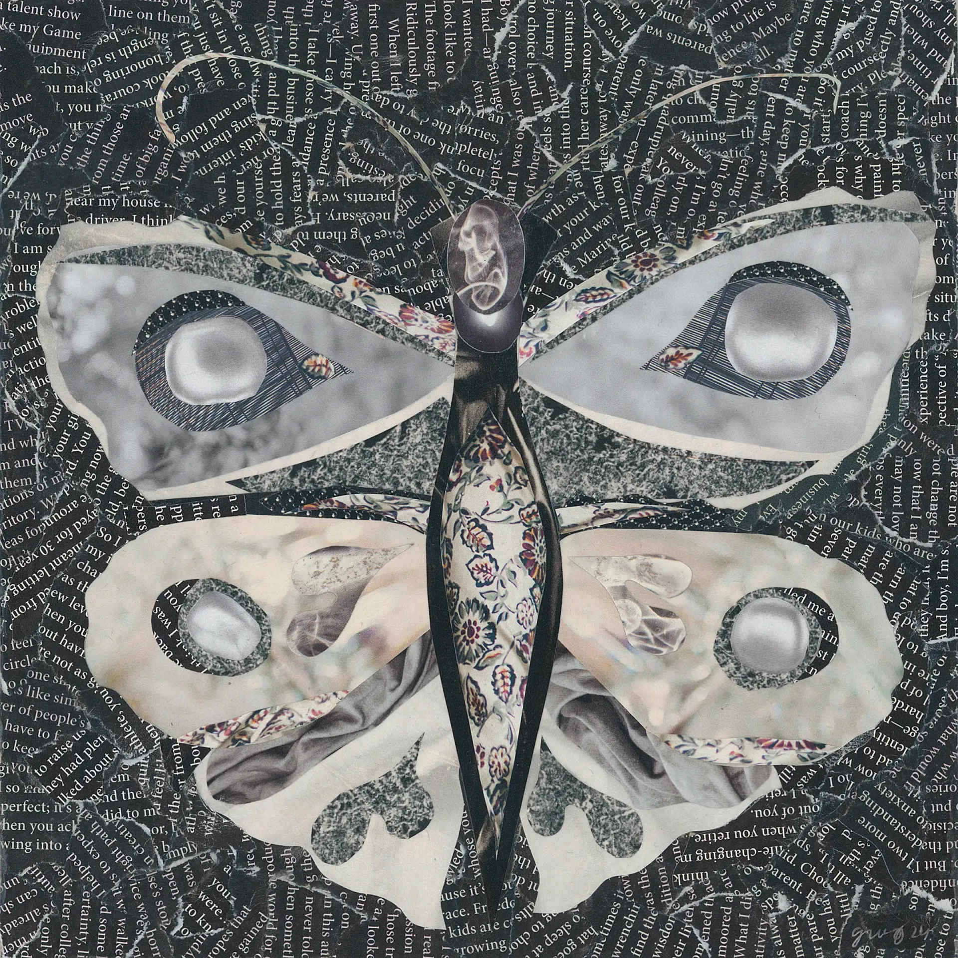 Textile art: white butterfly with floral print, on a dark background.