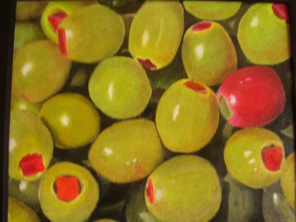 Green olives with red pimientos, close-up.