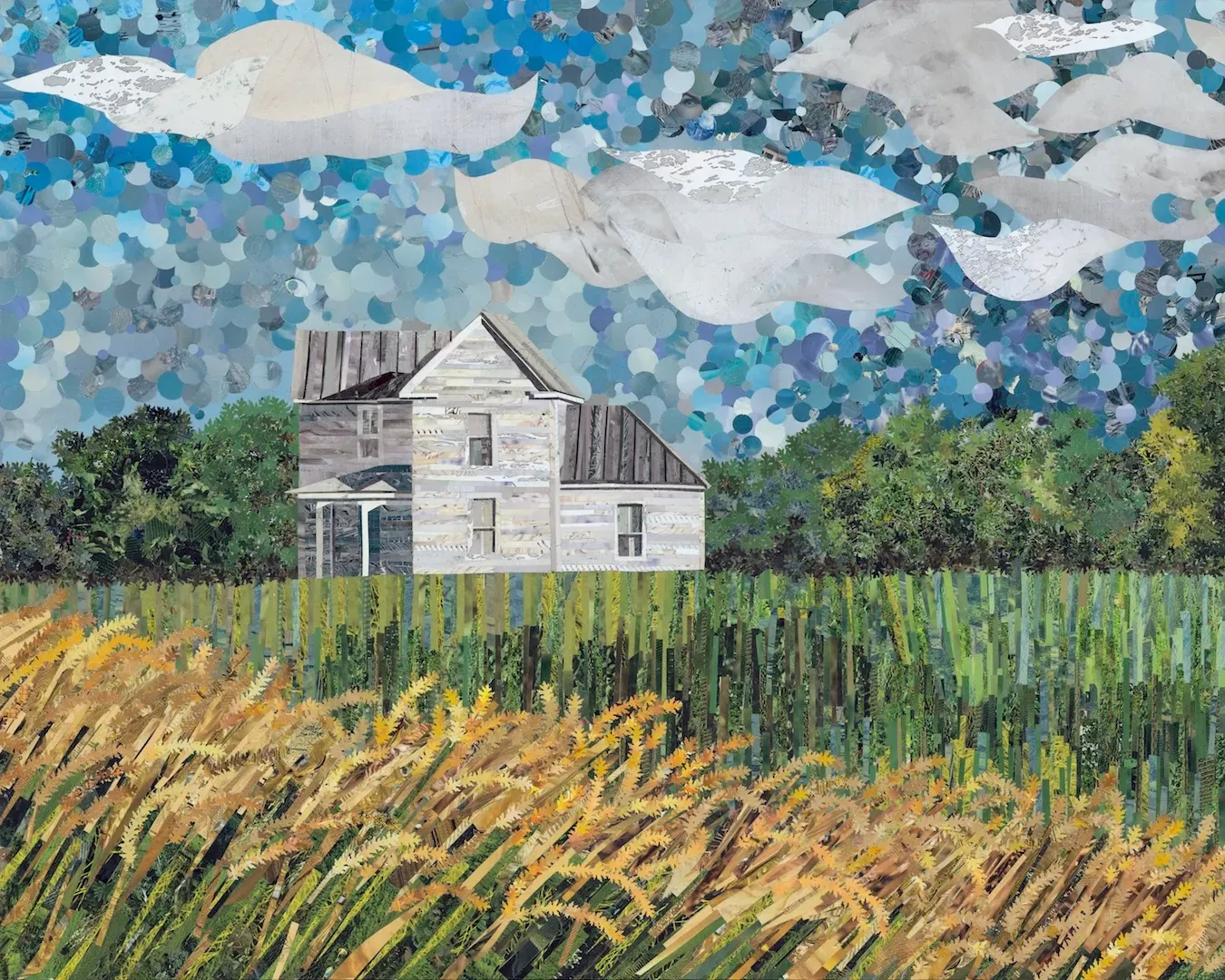 An old, weathered house in a field of wheat under a blue sky with clouds.
