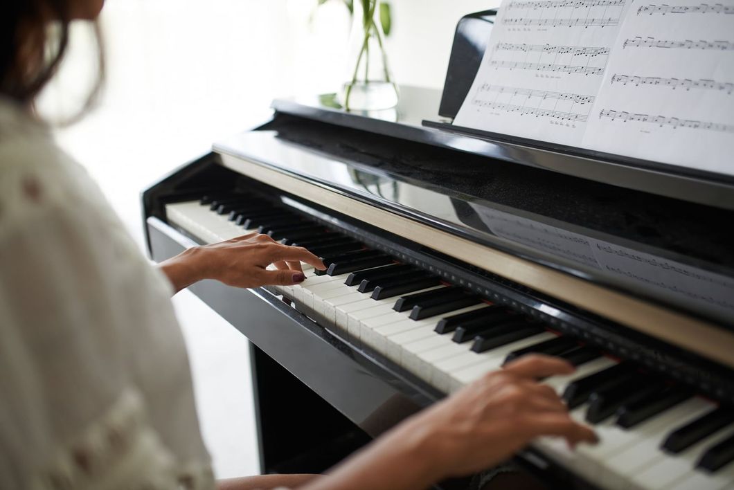 Woman Playing a Piano Woman Playing a Piano