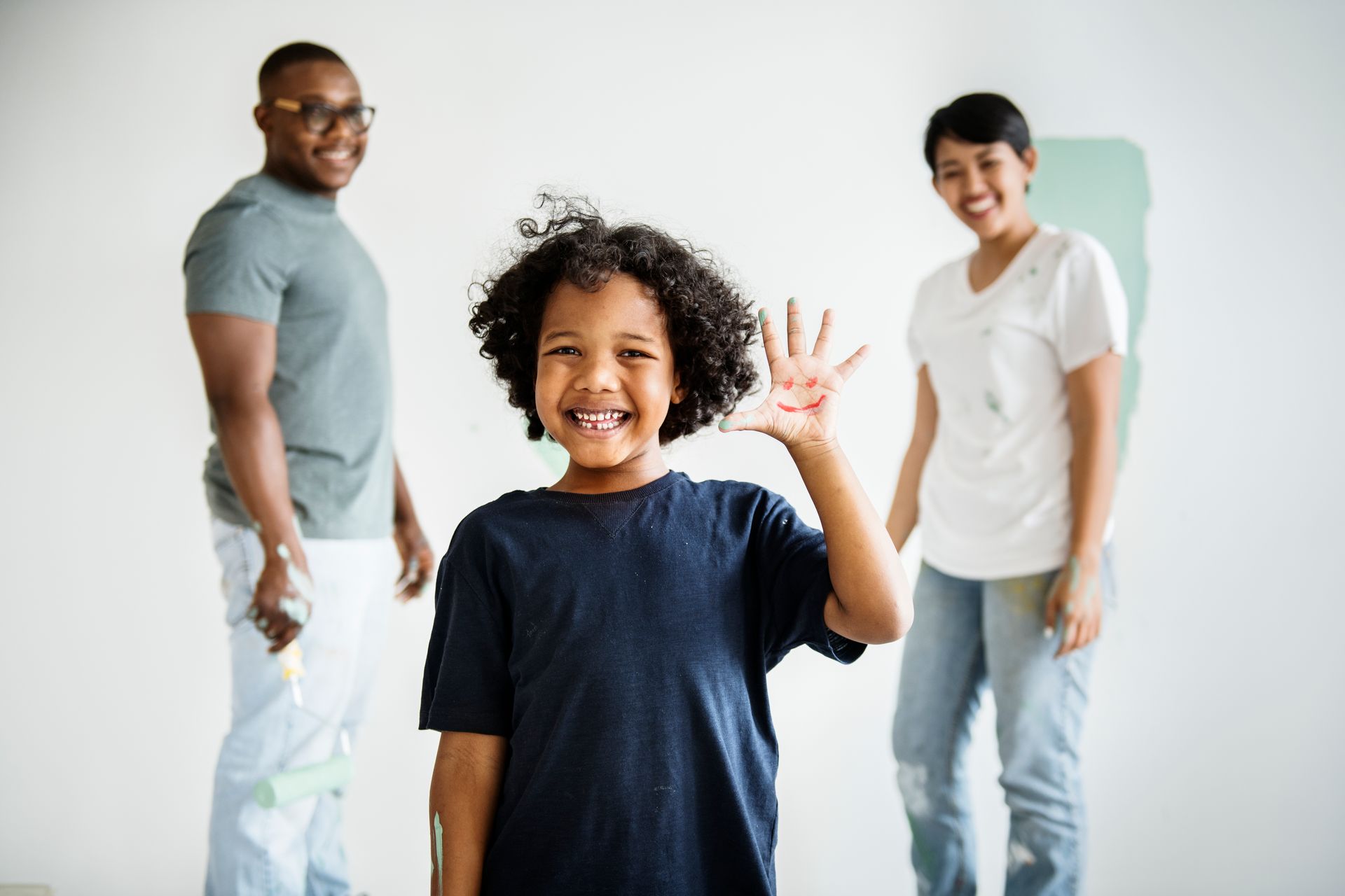 Diverse group of children interacting with supportive adults, representing early relationship foundations