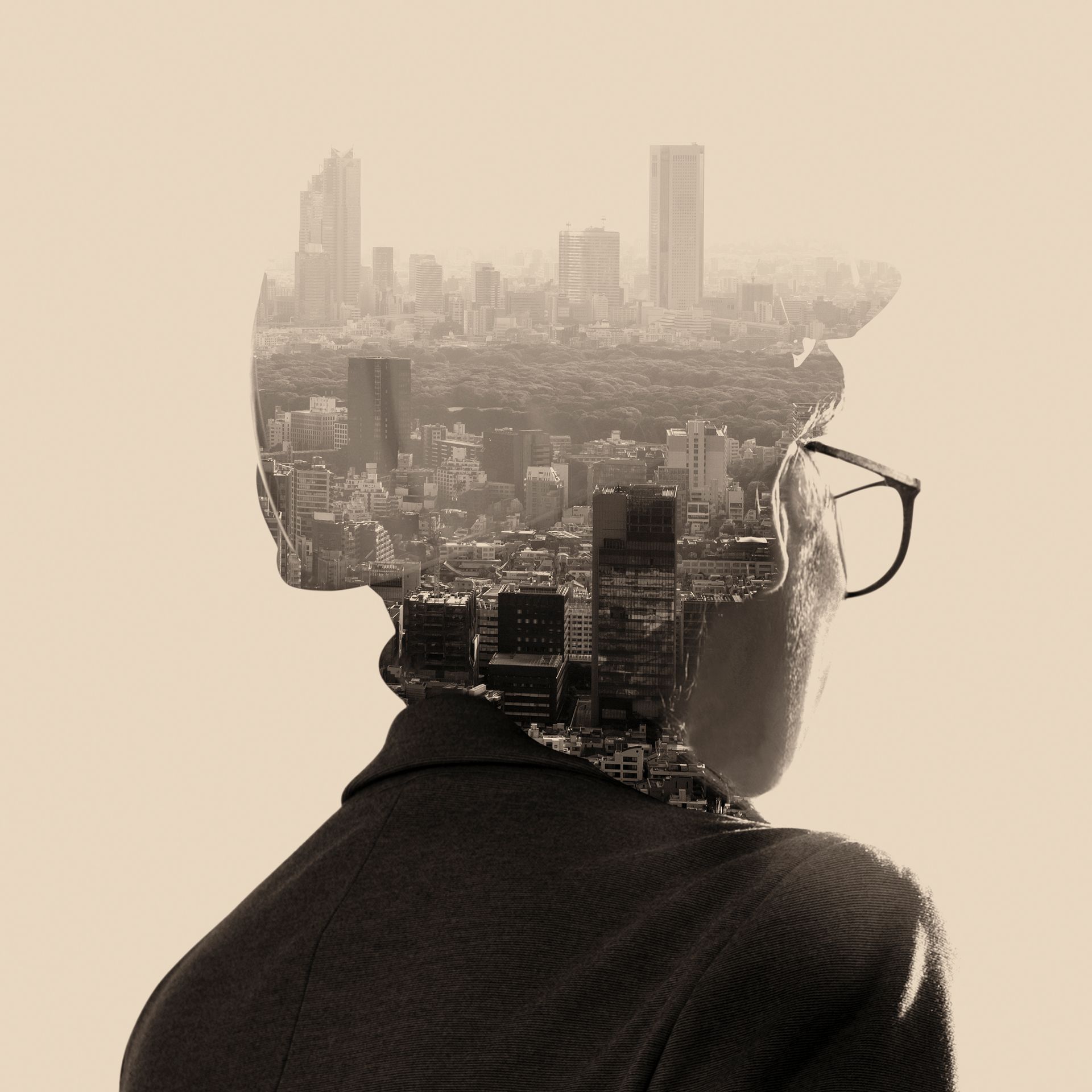 Silhouette of a person with cityscape double exposure, representing how past experiences shape our present self