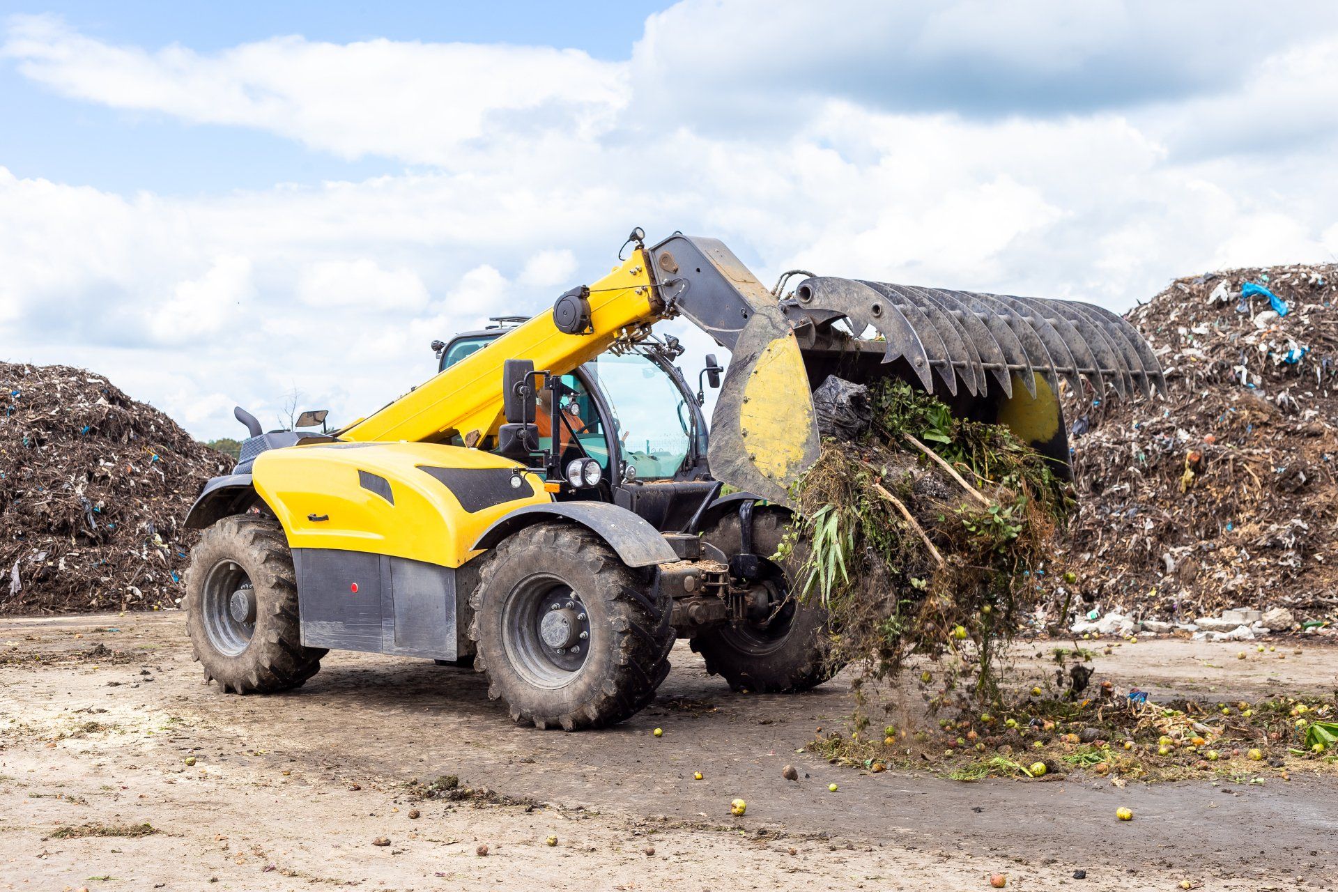 bulldozer scraping the trash