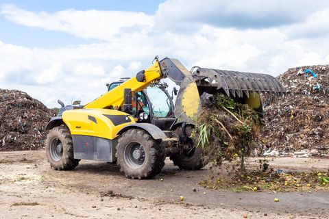 bulldozer scraping the trash
