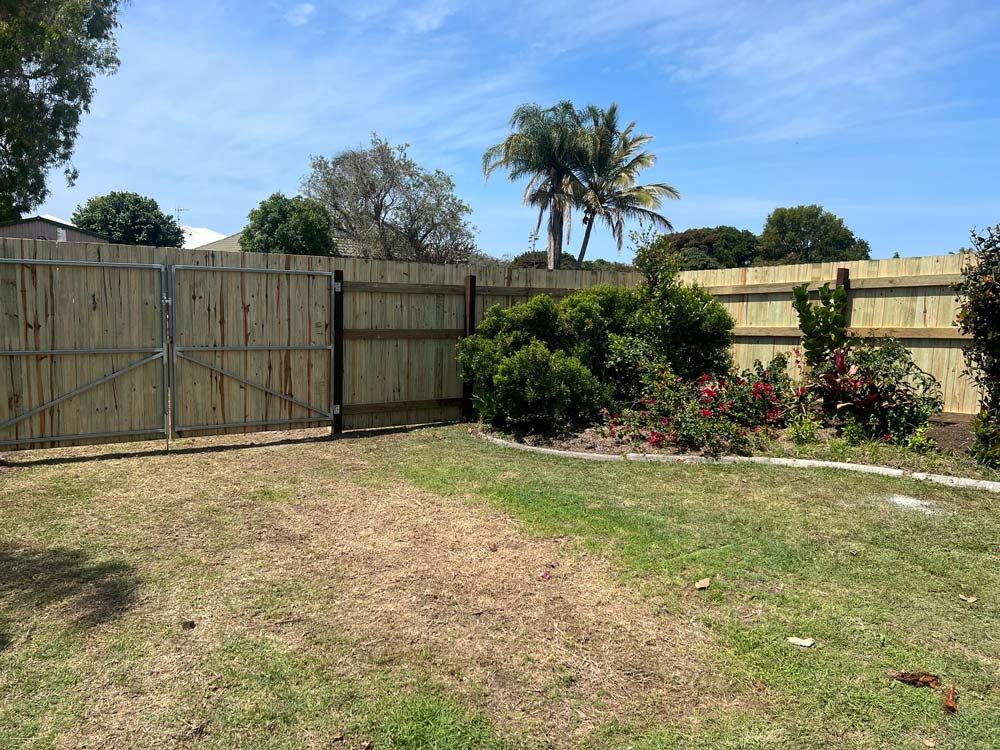 Wooden Fence Surrounding the Lawn — Landscaper in Bundaberg, QLD