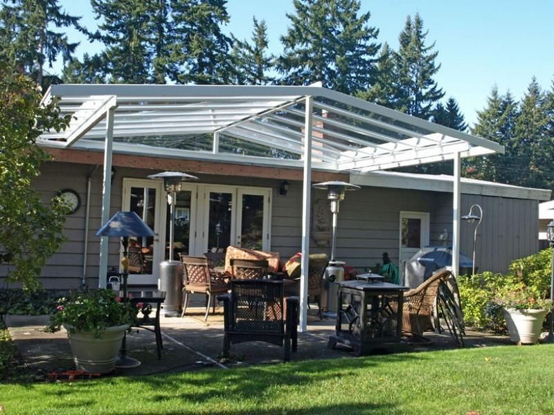 A house with a clear roof and a patio area