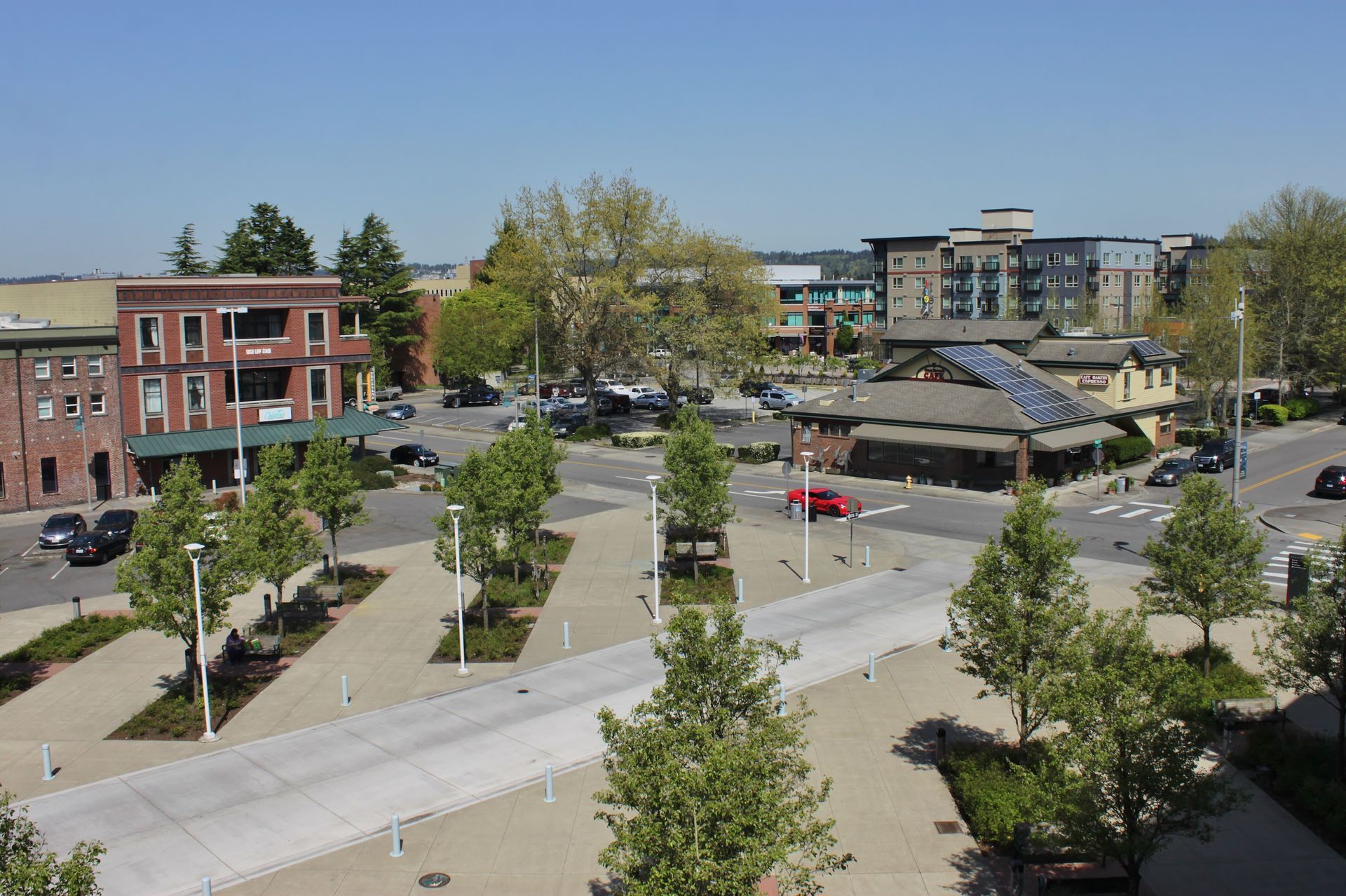 An aerial view of a city with lots of trees and buildings