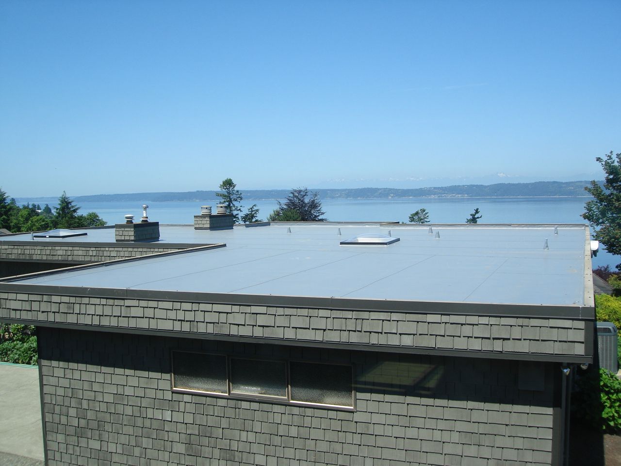 The roof of a building with a view of the ocean