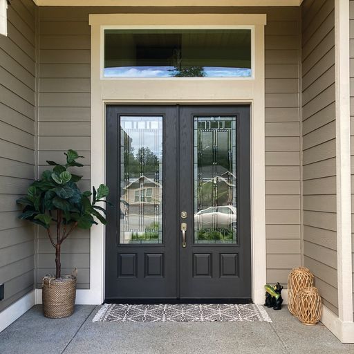 The front door of a house with a plant in front of it