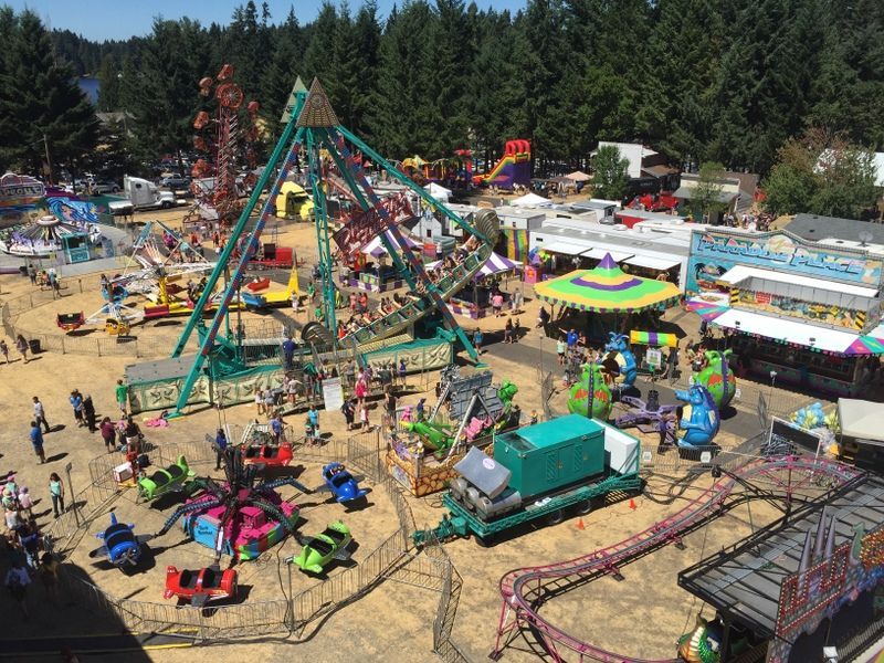 An aerial view of a carnival with a lot of rides
