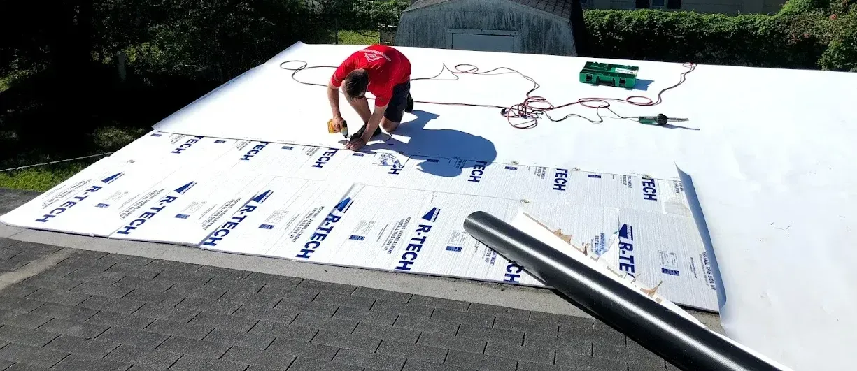 Durable, reflective PVC roofing membrane fully installed on a flat rooftop