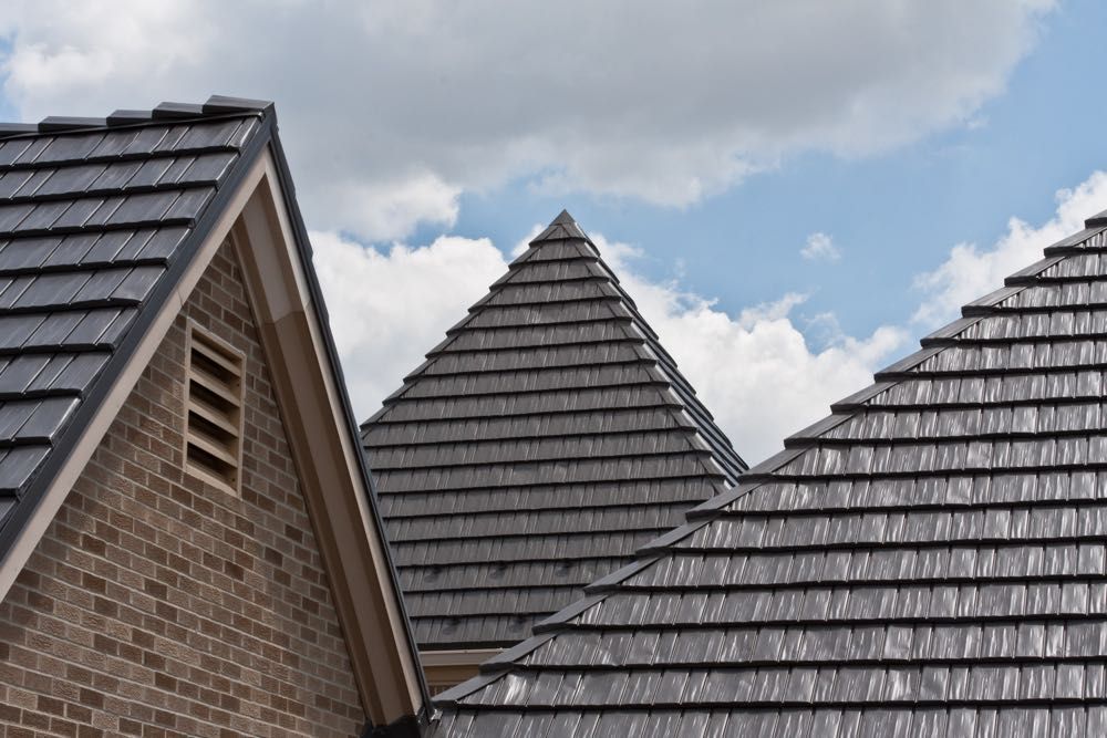 A brick building with a roof that looks like a pyramid.