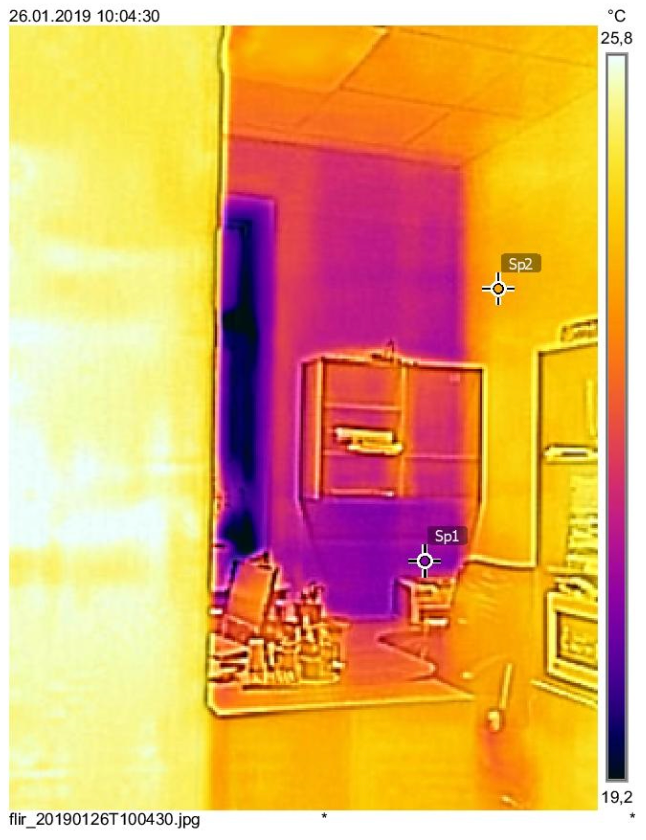 Thermal image of a room showing heat distribution: purples and oranges indicate varying temperatures.