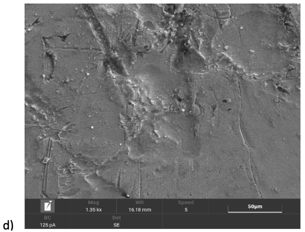 Microscopic view of a gray, textured surface with visible ridges and imperfections, possibly metal.