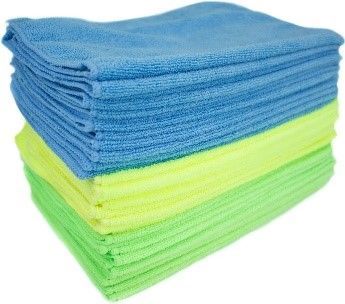 Stack of folded microfiber cleaning cloths in blue, yellow, and green