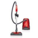 Red and black upright vacuum cleaner with hose and floor head on a white background