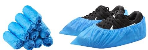 Blue disposable shoe covers and a pair of shoes covered in them on a white background