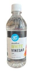 Bottle of white vinegar with a white cap and label on a plain background