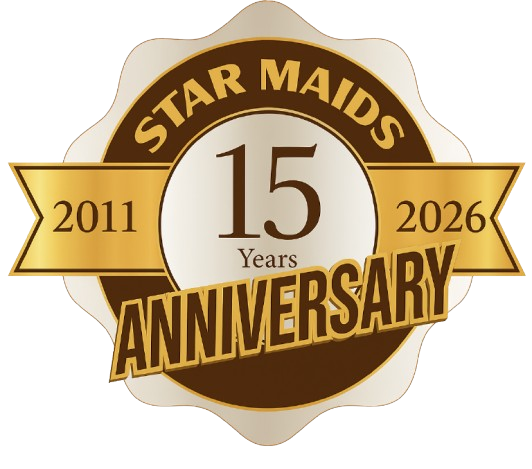 Star Maids 15-year anniversary emblem, gold and brown, with 2011 and 2026
