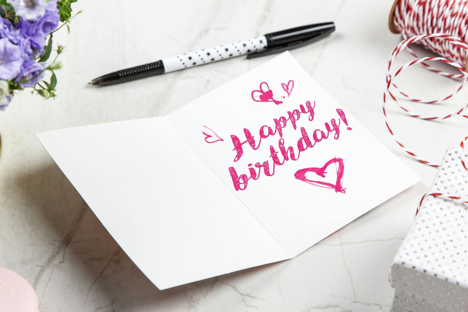 Open birthday card with pink 