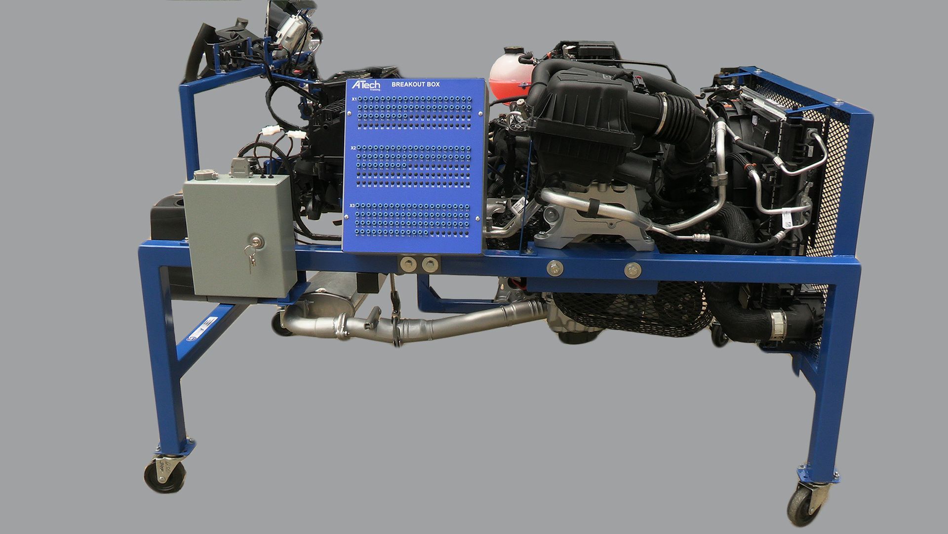 A motorcycle engine is sitting on top of a blue stand.