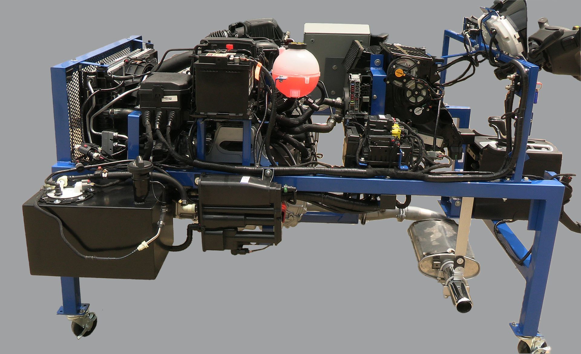 A blue and black machine with a red balloon on top of it