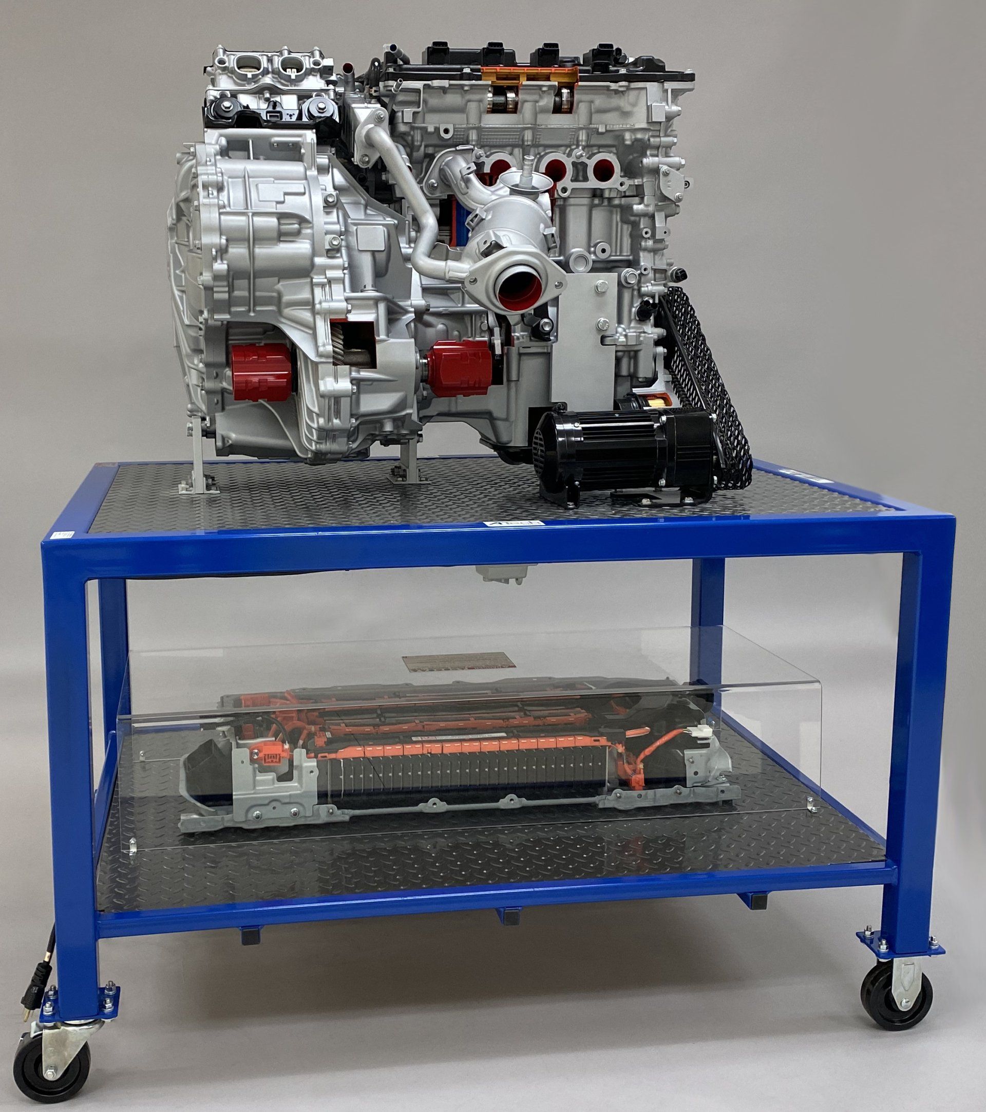 A model of a car engine on a blue table