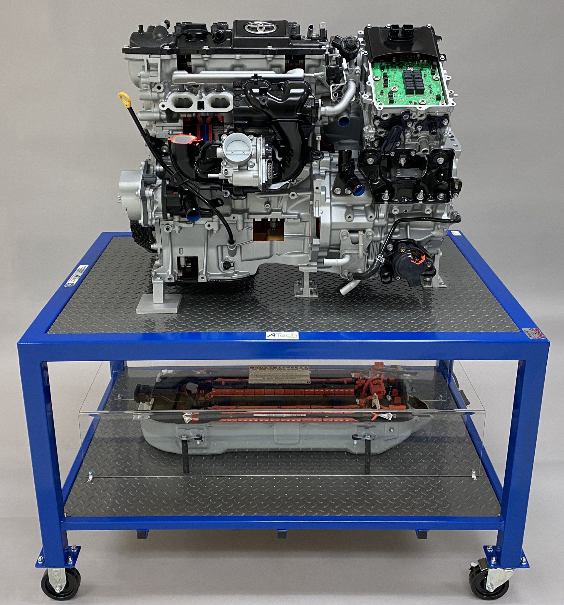 A model of a car engine on a blue cart
