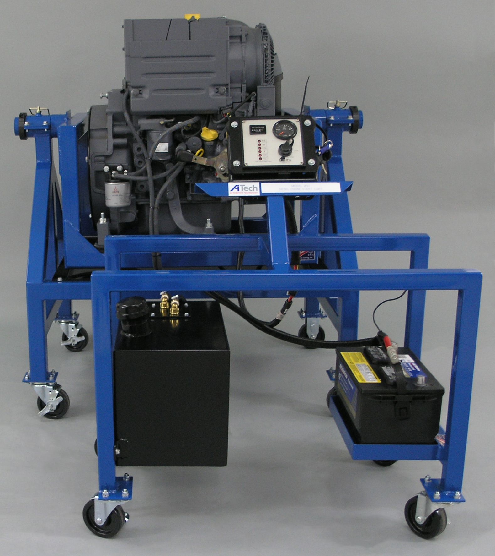 A blue cart with a motor and a battery on it