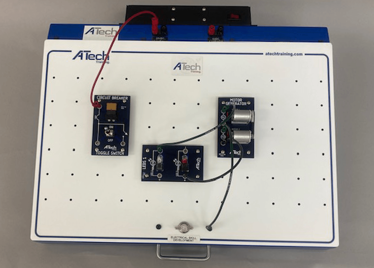 A white board that says ' atech ' on it