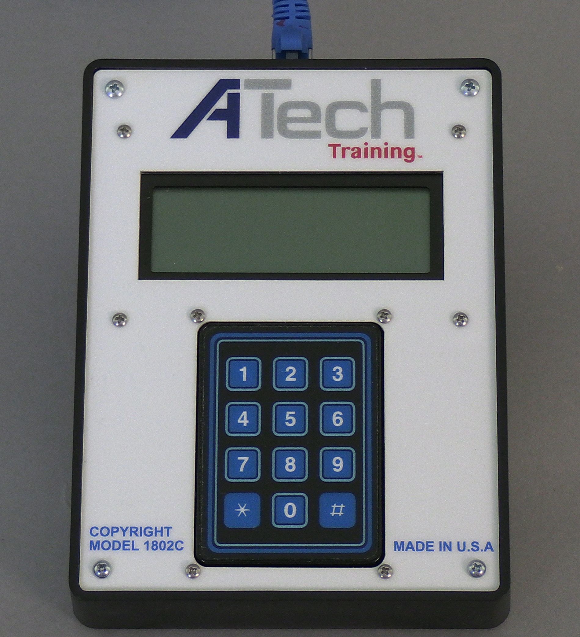 A black and white atech training device with blue buttons