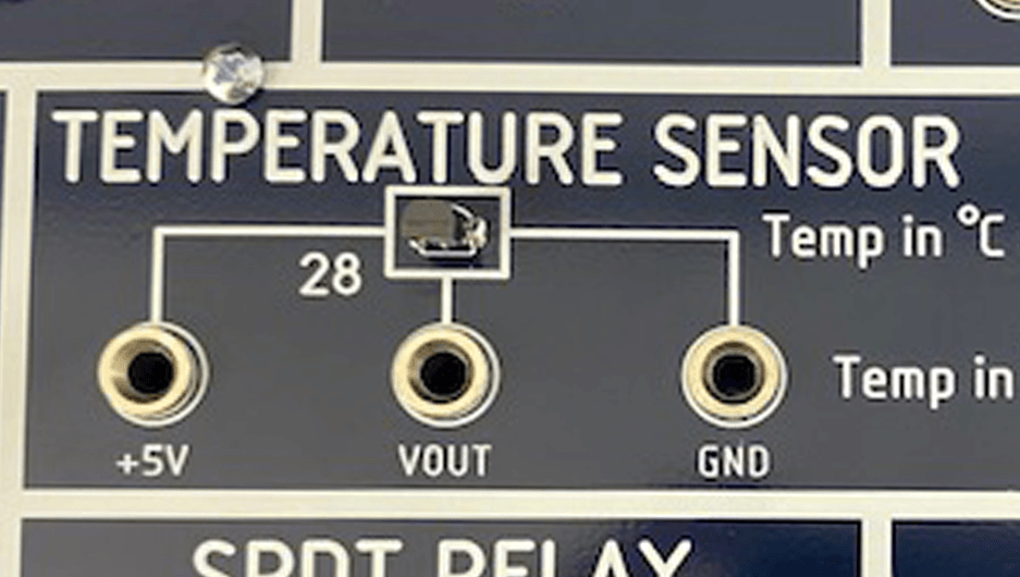 A close up of a temperature sensor on a board